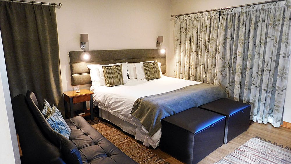 A modern Dankhof guest room with a king-size bed
